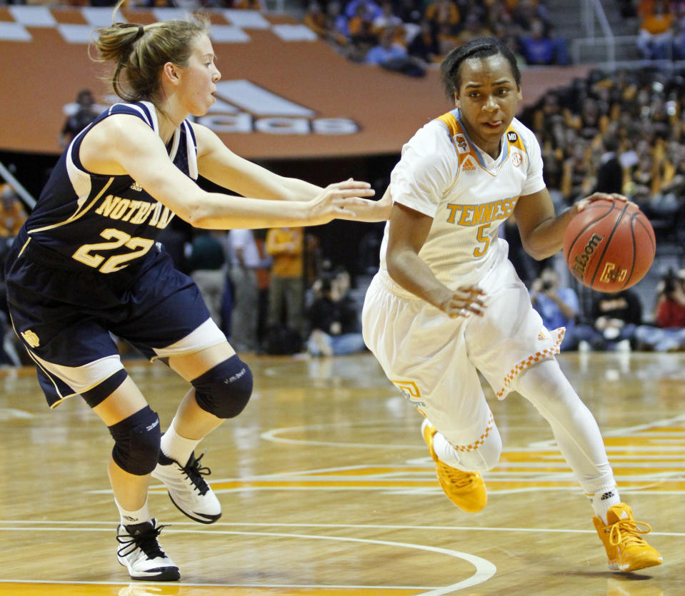 Tennessee guard Ariel Massengale (5) drives against Notre Dame guard Madison Cable (22) in the first half of an NCAA college basketball game Monday, Jan. 20, 2014, in Knoxville, Tenn. (AP Photo/Wade Payne)