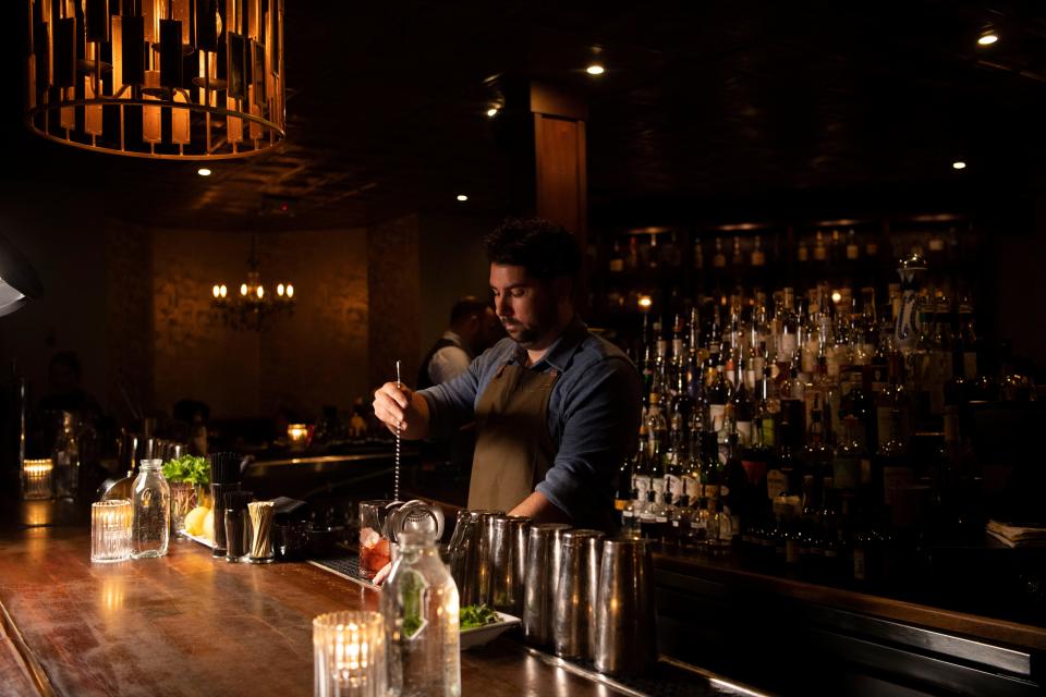 Matt Tocco mixes a cocktail called Murder to Excellence at The Patterson House in Nashville.