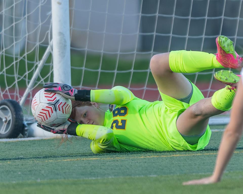 Hartland goalie Jenna Brock makes a diving save on a shot by Canton's Kayla Rankin late in the first half during a 0-0 tie Thursday, May 2, 2024.