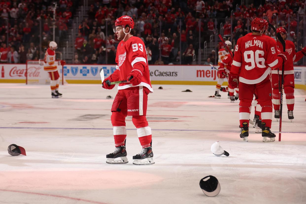 Alex DeBrincat of the Detroit Red Wings celebrates his hat trick in the third period while playing the Calgary Flames at Little Caesars Arena on October 22, 2023, in Detroit, Michigan.