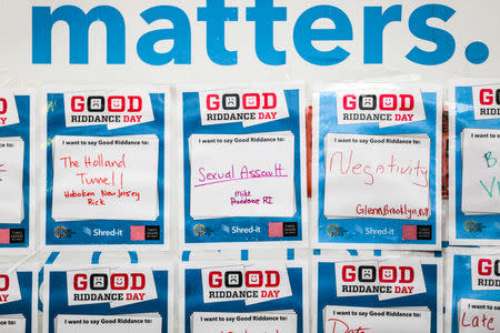 Messages expressing bad memories or events are taped onto the side of a truck before they are shredded during the National Good Riddance day ceremonial shredding of bad memories of 2018 in Times Square in the Manhattan borough of New York, U.S., December 28, 2018. REUTERS/Jeenah Moon