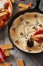 <p>This ghoulish dip is only 3 steps, making it the perfect last-minute dessert! </p><p>Get the <strong><a href="https://www.delish.com/cooking/recipe-ideas/recipes/a55544/ghost-smores-recipe/" rel="nofollow noopener" target="_blank" data-ylk="slk:Ghost S'mores Dip recipe;elm:context_link;itc:0;sec:content-canvas" class="link ">Ghost S'mores Dip recipe</a></strong> from Delish.</p><p><strong>RELATED: </strong><a href="https://www.goodhousekeeping.com/food-recipes/party-ideas/g4967/easy-dip-recipes/" rel="nofollow noopener" target="_blank" data-ylk="slk:80 Best Party Dip Recipes to Feed a Crowd;elm:context_link;itc:0;sec:content-canvas" class="link ">80 Best Party Dip Recipes to Feed a Crowd</a></p>