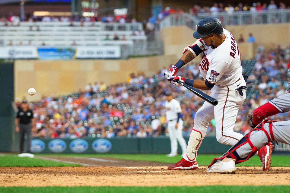 Minnesota Twins Luis Arraez swings into a three-run homer against the Cleveland Guardians in the seventh inning of a baseball game Tuesday, June 21, 2022, in Minneapolis. (AP Photo/Andy Clayton-King)