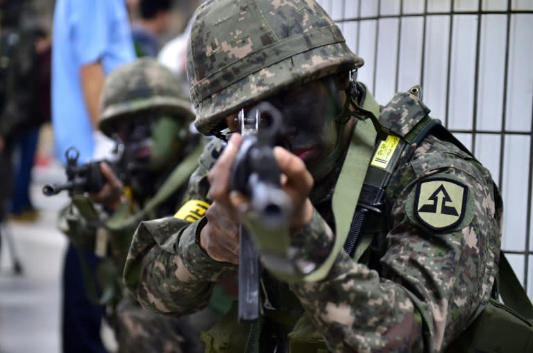 South Korean soldiers take a position during an anti-terror drill on the sidelines of South Korea-US joint military exercise, called Ulchi Freedom Guardian, at a subway station in Seoul, in 2015