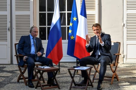 French President Emmanuel Macron meets with Russia's President Vladimir Putin, at his summer retreat of the Bregancon fortress on the Mediterranean coast, near the village of Bormes-les-Mimosas