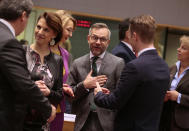 From left, Slovak State Secretary at the Foreign Ministry Frantisek Ruzicka, Austrian Minister for European Union Affairs Karoline Edtstadler, Finland Minister for European Affairs Tytti Tuppurainen, and German Minister of State for European Affairs Michael Roth attend a meeting of EU General Affairs ministers at the European Council building in Brussels, Tuesday, Feb. 25, 2020. European Union ministers are putting the final touches on the mandate that will be the guide for EU negotiator Michel Barnier as he sits own with UK officials to thrash out a free trade deal over the next ten months. (AP Photo/Virginia Mayo)