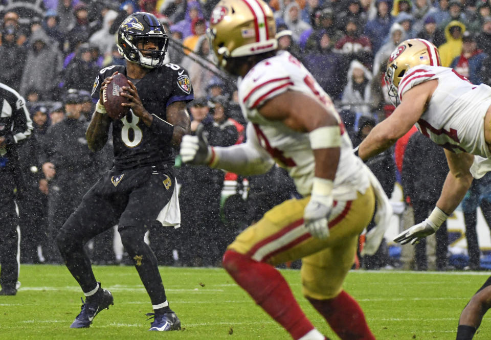 BALTIMORE, MD - DECEMBER 01: Baltimore Ravens quarterback Lamar Jackson (8) looks to pass against the San Francisco 49ers on December 1, 2019, at M&T Bank Stadium in Baltimore, MD. (Photo by Mark Goldman/Icon Sportswire via Getty Images)