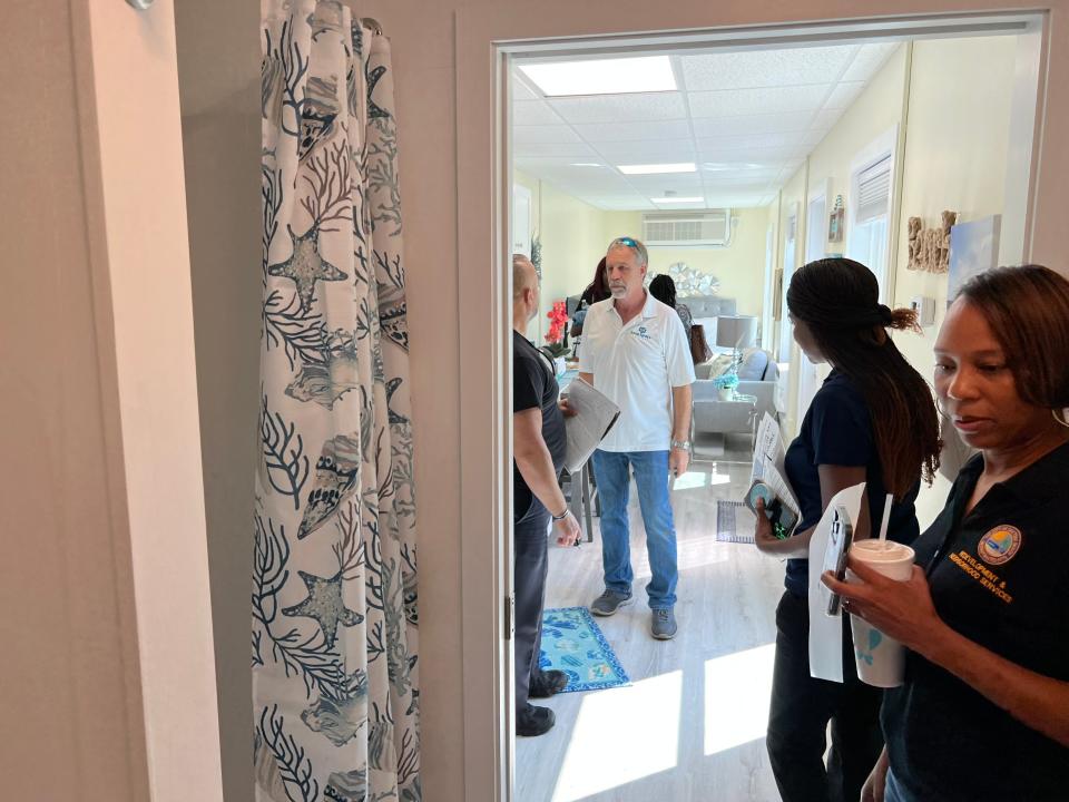 Attendees of the Housing Fair & Financial Wellness Clinic at Allen Chapel AME Church in Daytona Beach on Saturday, April 29, 2023, check out the inside of a shipping container converted into a modular home by Snap Space Solutions. Prices start at $69,900, according to the Ormond Beach company's website. The event was put on by the church, Mid-Florida Housing Partnership, the City of Daytona Beach and Daytona Beach Area Association of Realtors to mark the anniversary of the signing of the federal Fair Housing Act in April 1968. Pictured in the foreground: LaShondra Robinson, housing manager for the City of Daytona Beach.