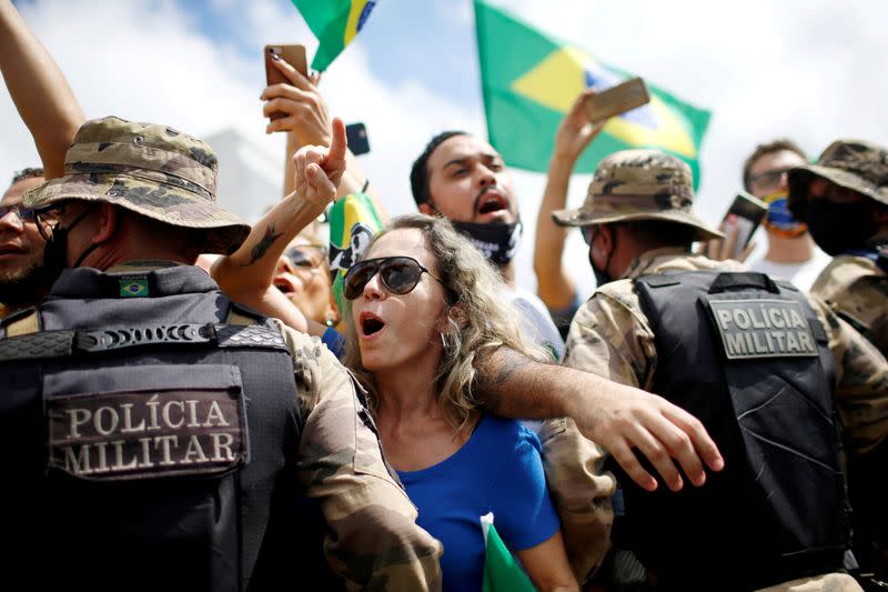Demonstrators take part in a protest in favor of Brazillian President Jair Bolsonaro in front of the Planalto Palace, amid the coronavirus disease (COVID-19) outbreak, in Brasilia
