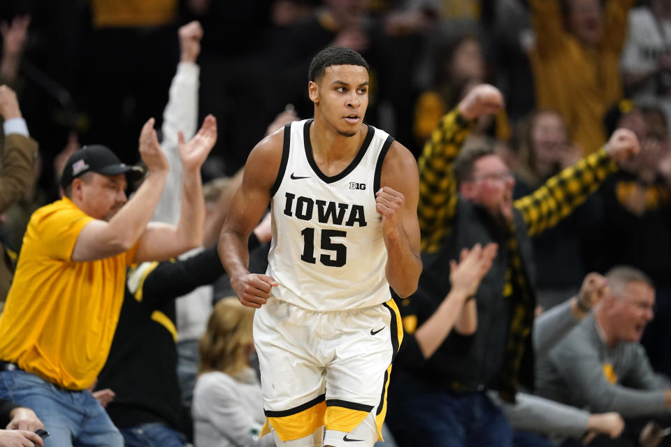 Iowa forward Keegan Murray celebrates after making a basket at the end of the first half of an NCAA college basketball game against Michigan, Thursday, Feb. 17, 2022, in Iowa City, Iowa. (AP Photo/Charlie Neibergall)