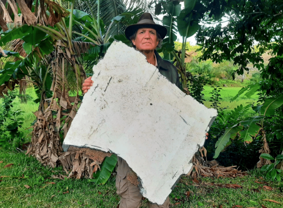 Blaine Gibson holding what is believed to be a trunnion door from the missing airliner (Blaine Gibson and Richard Godfrey/MH370 Debris Analysis)
