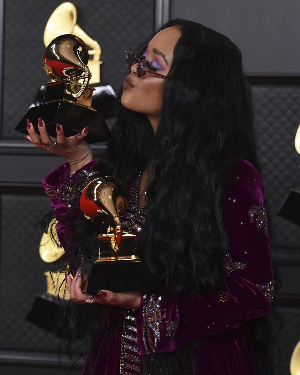 H.E.R. poses in the press room with the award for song of the year for "I Can't Breathe" at the 63rd annual Grammy Awards at the Los Angeles Convention Center on Sunday, March 14, 2021. (Photo by Jordan Strauss/Invision/AP)