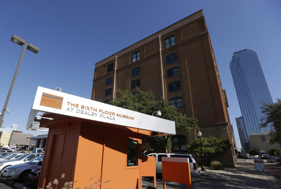 The former Texas School Book Depository, now the Sixth Floor Museum, overlooks Dealey Plaza in Dallas, Tuesday, Nov. 12, 2013. The depository was the site where Lee Harvery Oswald fired a gun, killing President John F. Kennedy on Nov. 22, 1963. (AP Photo/LM Otero)