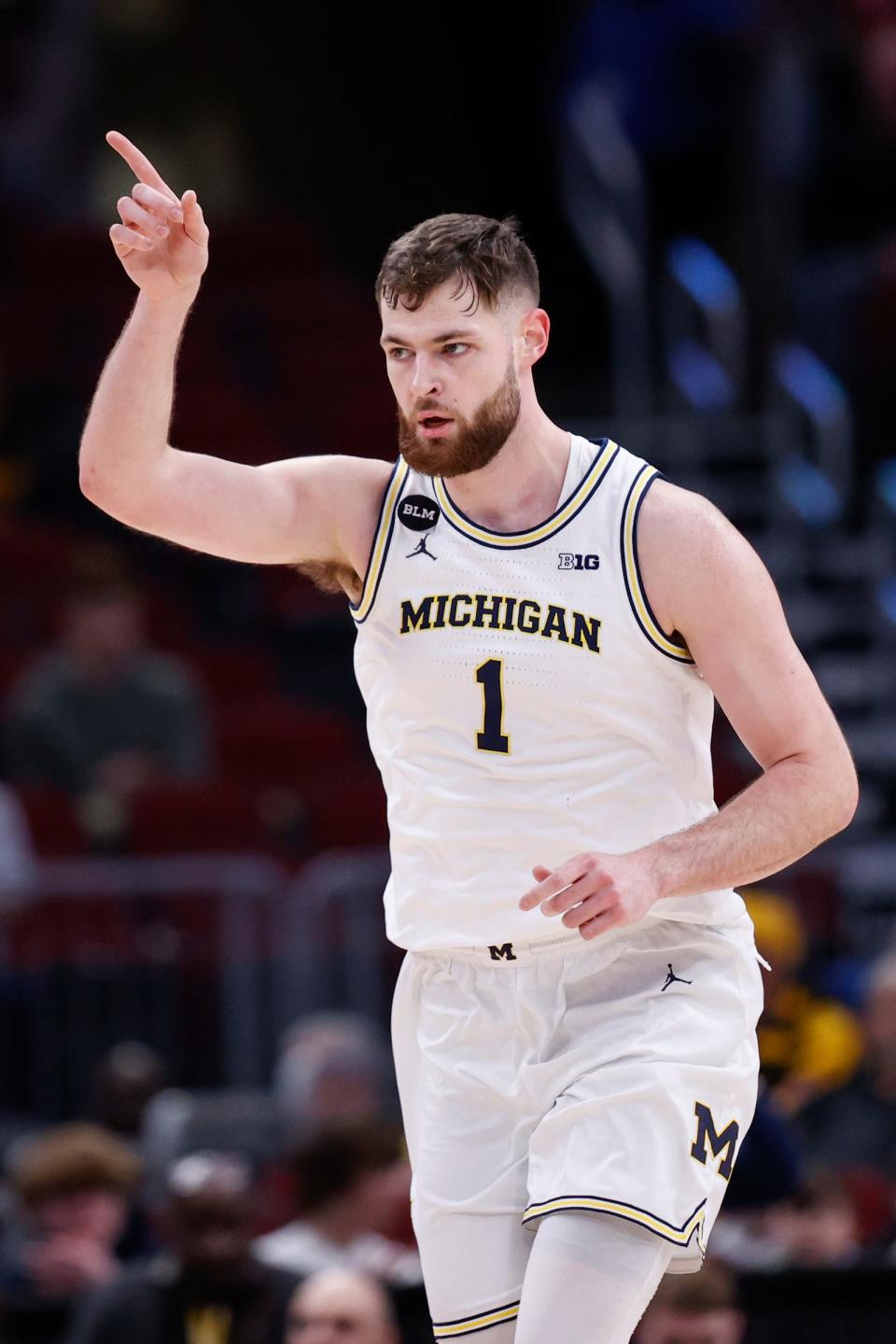 Michigan center Hunter Dickinson reacts after scoring against Rutgers during the first half of the second round of the Big Ten tournament on Thursday, March 9, 2023, in Chicago.