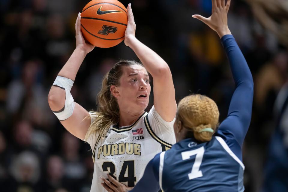 Purdue Boilermakers forward Caitlyn Harper (34) looks to pass over the defense during the NCAA women’s basketball game against the Penn State Nittany Lions, Wednesday Feb. 28, 2024, at Mackey Arena in West Lafayette, Ind. Penn State won 93-88.