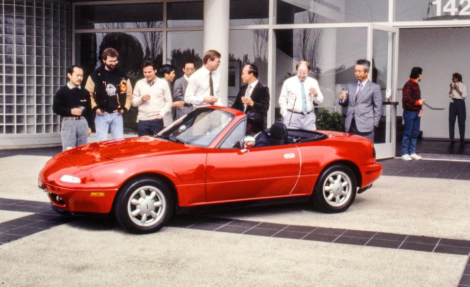 <p>After soliciting design proposals from its Japanese and American operations, Mazda picks the American option, which becomes the production MX-5 Miata. Unlike the Tokyo proposal, which was mid-engine, rear-drive like Toyota's contemporary MR2, and the front-drive sketch from Hiroshima, the product of Mazda's American design studio boasts a classic British sports-car layout: It is rear-drive, with its engine in front. </p>