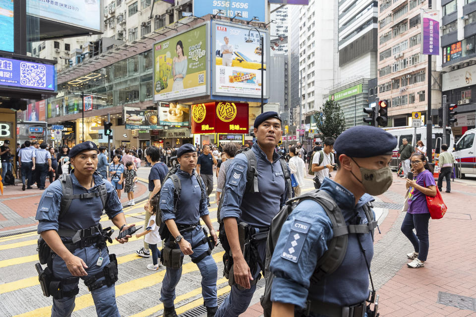 Counter Terrorism Unit patrol in the Causeway Bay area on the 35th anniversary of China's Tiananmen Square crackdown in Hong Kong, Tuesday, June 4, 2024. (AP Photo/Chan Long Hei)