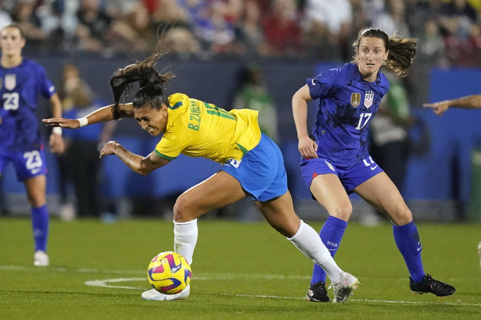 Brazil forward Bia Zaneratto (16) loses her footing after a foul by United States midfielder Andi Sullivan (17) during the first half of a SheBelieves Cup soccer match Wednesday, Feb. 22, 2023, in Frisco, Texas. (AP Photo/LM Otero)