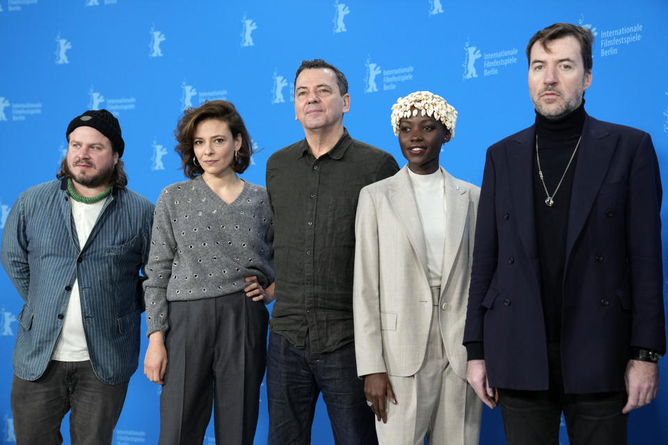 The Film Festival, Berlinale International Jury from left, Brady Corbet, Jasmine Trinca, Christian Petzold, Lupita Nyong'o and Albert Serra pose for media during a photo-call at the opening day of International Film Festival, Berlinale, in Berlin, Thursday, Feb. 15, 2024. The 74th edition of the festival will run until Sunday, Feb. 25, 2024 at the German capital. (AP Photo/Ebrahim Noroozi)