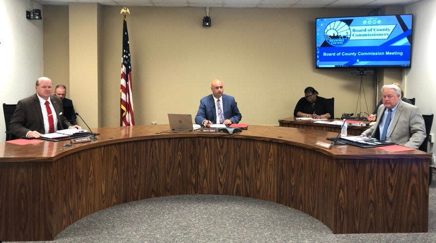 Shawnee County commissioners, from left, Kevin Cook, Aaron Mays and Bill Riphahn gave themselves 5% raises Thursday morning.