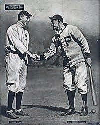 Ty Cobb (left) shakes hands with fellow baseball star Honus Wagner.