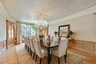 <p>The dining room has beautiful wood floors and trim. (Sotheby’s International Realty) </p>