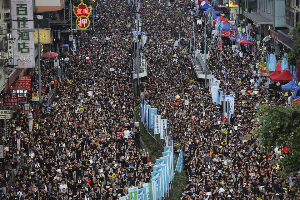 In this July 1, 2019, file photo, protesters flood the streets as they take part in a annual rally in Hong Kong. A national security law enacted in 2020 and COVID-19 restrictions have stifled major protests in Hong Kong including an annual march on July 1. (AP Photo/Kin Cheung, File)