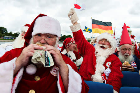 Participants from different countries take part in the 59th World Santa Convention in Copenhagen, Denmark, July 18, 2016. Scanpix Denmark/Mathias Loevgreen Bojesen/via REUTERS