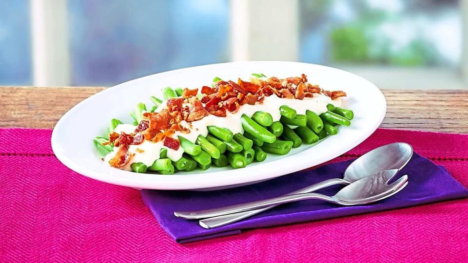 Green Beans in Sherry-Bacon Cream Sauce sits in a bowl (Side dishes for meatloaf)