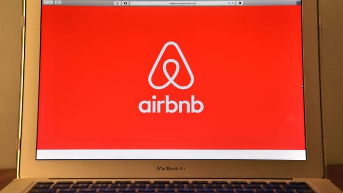 The Airbnb logo is displayed on a computer screen. In an Airbnb property in Mexico City, three Black travelers were found dead on Oct. 30 from what appears to be carbon monoxide poisoning. (Photo: Carl Court/Getty Images)