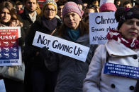 <p>A woman holds a placard reading “Not giving up” during a rally in solidarity with supporters of the Women’s March taking place in Washington and many other cities on January 21, 2017, in Lyon, southeastern France, one day after the inauguration of the president. (JEAN-PHILIPPE KSIAZEK/AFP/Getty Images) </p>