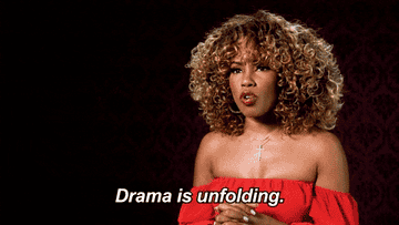 woman saying "drama is unfolding"