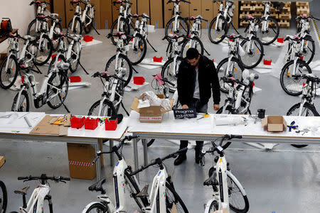 An employee works around Alpha bikes, the first industrialised bicycle to use a hydrogen fuel cell at the Pragma Industries factory in Biarritz, France, January 15, 2018. REUTERS/Regis Duvignau