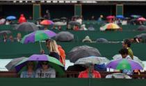 Britain Tennis - Wimbledon - All England Lawn Tennis & Croquet Club, Wimbledon, England - 1/7/16 General view of spectators during a rain delay REUTERS/Toby Melville