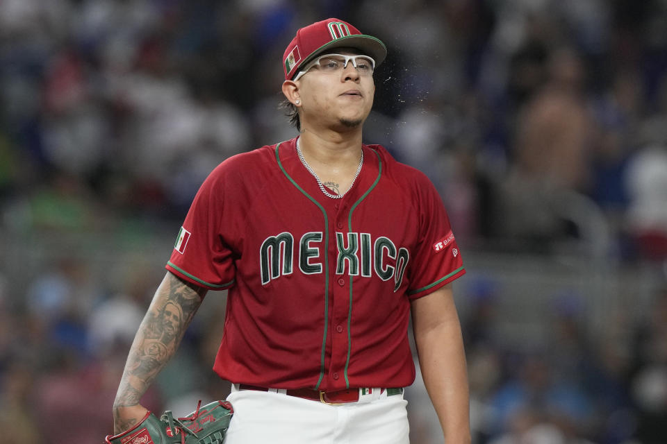 Mexico starting pitcher Julio Urias (7) reacts after Puerto Rico hit a second home run, scoring four runs, in the first inning at a World Baseball Classic game, Friday, March 17, 2023, in Miami. (AP Photo/Marta Lavandier)