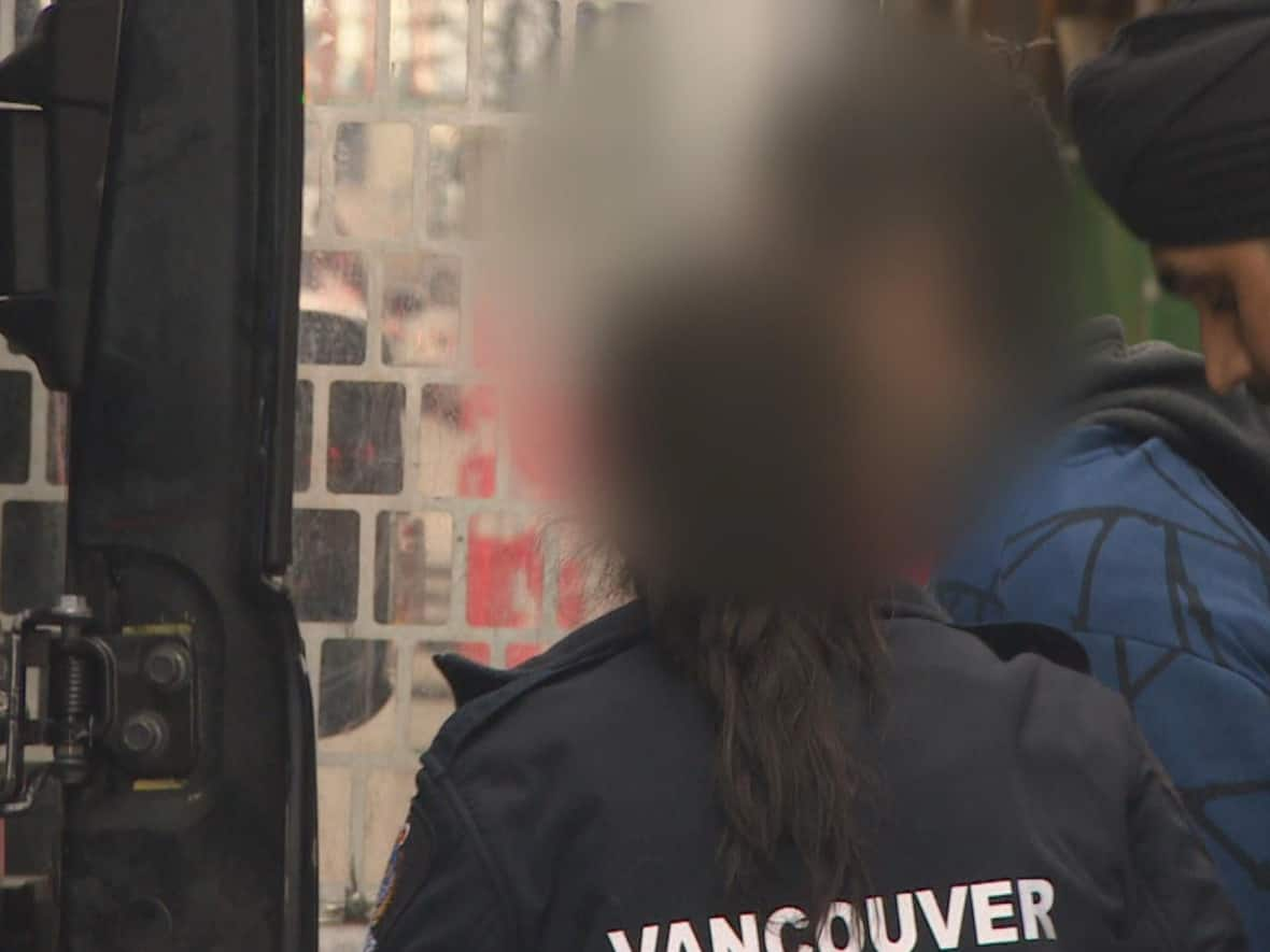 Vancouver police officers arrest a 46-year-old man following unprovoked attacks that sent two people to hospital on Wednesday. (CBC - image credit)