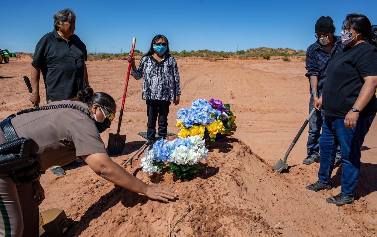 A funeral is held for Arnold Billy, who was a victim of COVID-19, at Tuba City Community Cemetery in Tuba City, Ariz., on May 22, 2020.