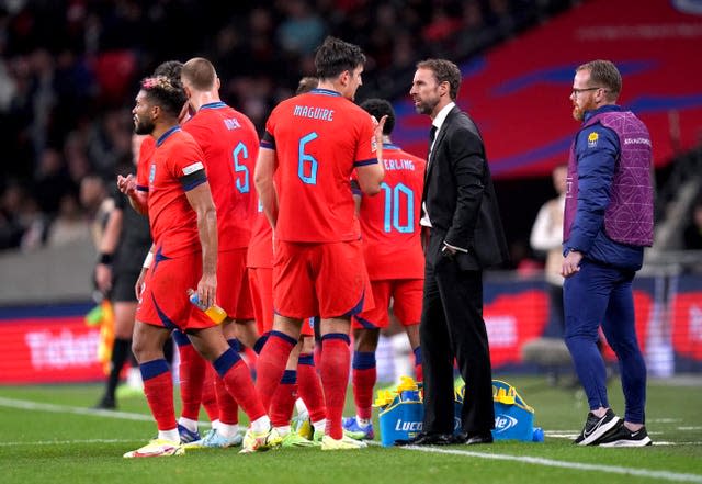 Gareth Southgate speaks to Harry Maguire