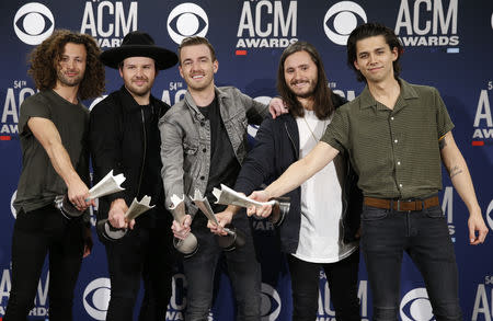 54th Academy of Country Music Awards – Photo Room– Las Vegas, Nevada, U.S., April 7, 2019 – Lanco pose backstage with their award for New Duo or Group of The Year award. REUTERS/Steve Marcus