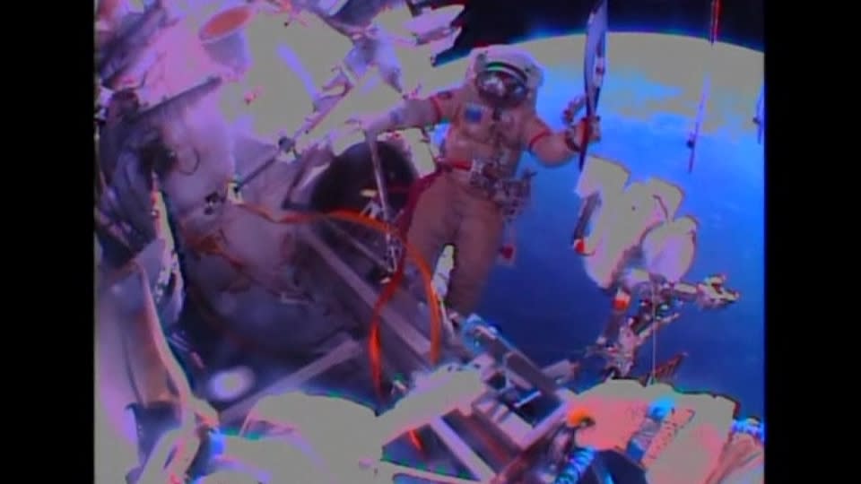 Cosmonauts take Sochi Olympic torch on spacewalk