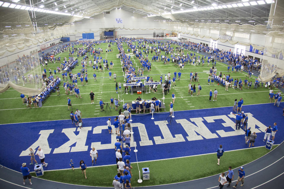 Kentucky fans fill Nutter Field House to meet their favorite players and coaches during the annual NCAA college football Fan Day in Lexington, Ky., Saturday, Aug. 8, 2015. (AP Photo/ David Stephenson)