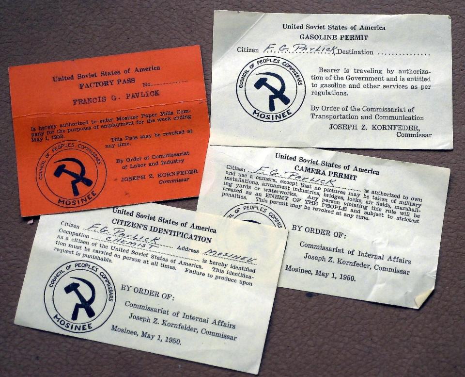 Organizers of the Mosinee May Day event issued mock communist identification papers and vouchers to buy food and carry a camera.