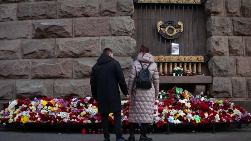 Two Russians mourn victims in Moscow concert hall attack