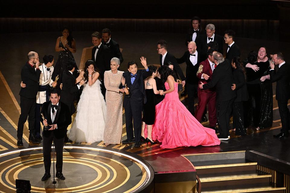 US film producer Jonathan Wang (C) accepts the Oscar for Best Picture for "Everything Everywhere All at Once" onstage during the 95th Annual Academy Awards at the Dolby Theatre in Hollywood, California on March 12, 2023.