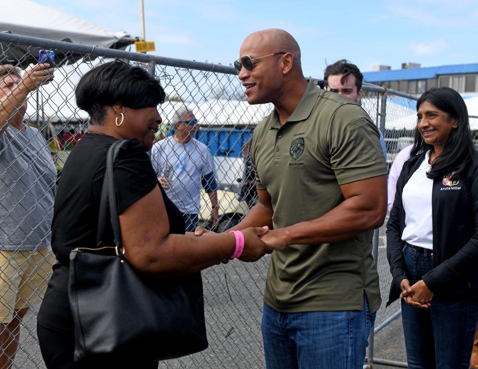 Crisfield Mayor Darlene Taylor talks with Gov. Wes Moore at the J. Millard Tawes Crab and Clam Bake Wednesday, Sept. 27, 2023, at Somers Cove Marina in Crisfield, Maryland.