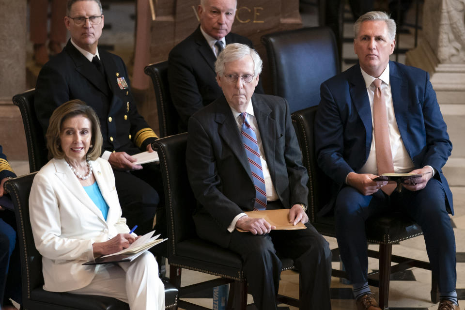 Speaker of the House Nancy Pelosi, D-Calif., Senate Minority Leader Mitch McConnell, R-Ky., and House Minority Leader Kevin McCarthy, R-Calif., sit together as they attend a Congressional Gold Medal ceremony to honor members of the Merchant Marine who served in World War II, at the Capitol in Washington, Wednesday, May 18, 2022. (AP Photo/J. Scott Applewhite)