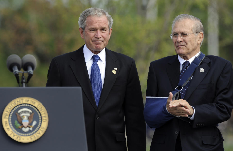 FILE - In this Sept. 11, 2008, file photo, with former Defense Secretary Donald Rumsfeld next to him, President George W. Bush concludes his remarks during a memorial ceremony at the Pentagon, marking the 7th anniversary of the Sept. 11 attacks on the Pentagon and World Trade Center. The family of Rumsfeld says he died Tuesday, June 29, 2021. He was 88. (AP Photo/Susan Walsh)