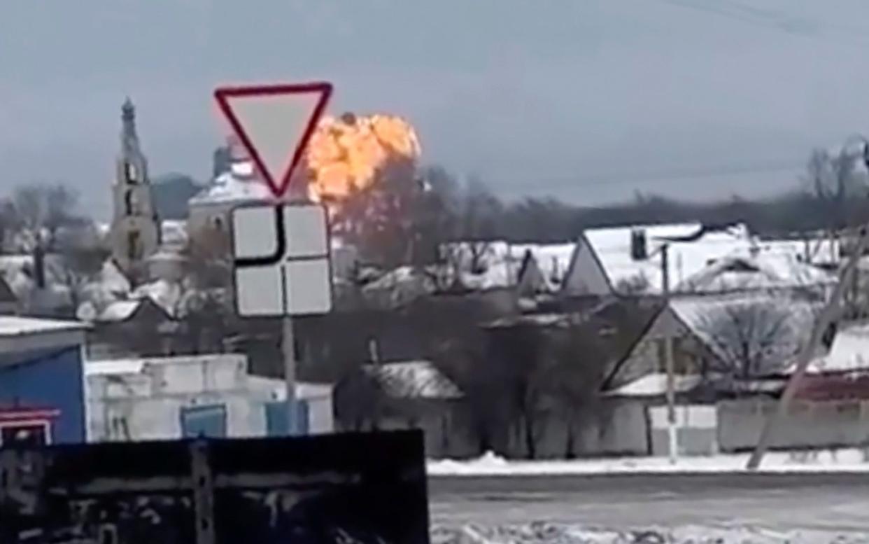 Flames rising from the scene of a warplane crashed at a residential area near Yablonovo, Belgorod region