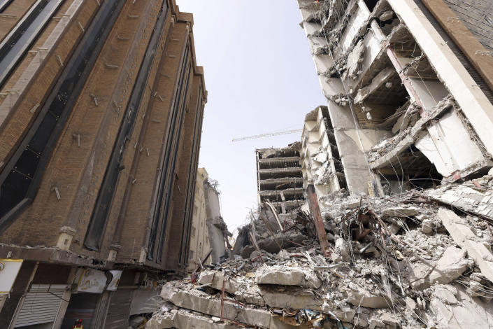 In this photo released by official website of the office of Iranian Senior Vice-President, on Friday, May 27, 2022, ruins of a tower at under construction 10-story Metropol Building remains after it collapsed on Monday, in the southwestern city of Abadan, Iran. Rescue teams at the site of the tower pulled five more bodies from the rubble on Friday, bringing the death toll in the disaster to 24. (Iranian Senior Vice-President Office via AP)