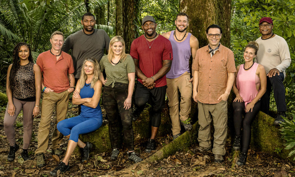 From left: Eboni K. Williams, Craig Morgan, Metta World Peace, Paulina Porizkova (seated), Lauren Alaina, Ray Lewis, Colton Underwood, host Mauro Ranallo, Jodie Sweetin and Mike Singletary - Credit: CBS